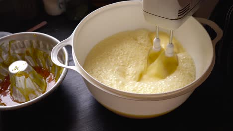 Homemade-cake-flan-mixture,-electric-whisk-mixer-aerating-mixture