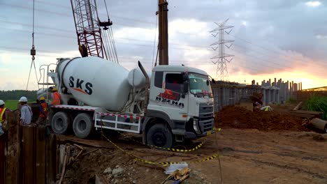 Mixer-truck-deliver-concrete-to-monorail-construction-site-on-Java,-Indonesia