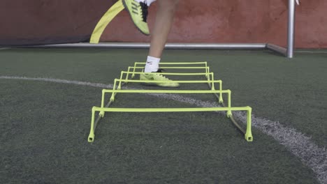 The-football-players-on-a-speed-and-agility-training-ladder-rings-in-the-field