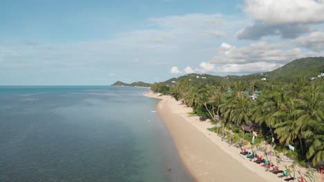 Beautiful-Beach-with-Palm-Trees-and-Mountains-without-People-Koh-Samui-Thailand