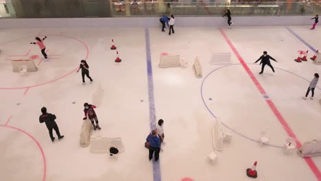 People-of-all-ages-are-seen-enjoying-and-learning-indoor-ice-skating-at-a-shopping-mall-in-Hong-Kong