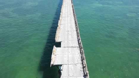 Closeup-aerial-journey-down-the-Old-Bahia-Honda-Railway-Bridge-in-the-Florida-Keys,-Florida,-USA