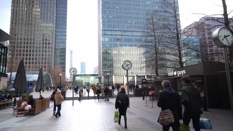 Walking-through-Reuters-Plaza,-London,-on-busy-day