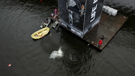 A-Female-Diver-Competes-In-A-Outdoor-Diving-Contest-In-The-Vltava-River,-Prague
