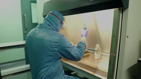 Scientist-Wearing-Full-PPE-Working-In-Clean-Room