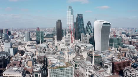 Cinematic-aerial-drone-shot-of-City-of-London-Skyscrapers-on-a-sunny-da