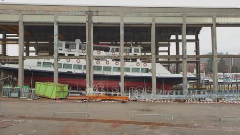 Ferry-boat-inside-shipyard-at-harbor-of-Arona-on-Lake-Maggiore