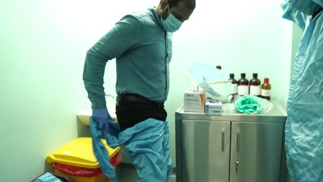 Medical-Staff-Putting-On-PPE-Kit-At-Karachi-Hospital-In-Pakistan