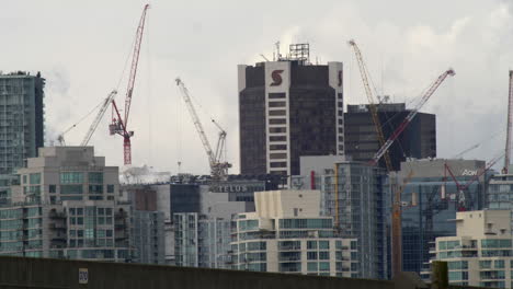 Vancouver-cityscape-with-construction-cranes