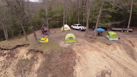 Outdoor-camping-by-the-Muskegon-River-in-the-forest-of-Leota,-Michigan---aerial