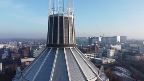 Liverpool-Metropolitan-cathedral-contemporary-city-famous-rooftop-spires-aerial-close-to-pull-back
