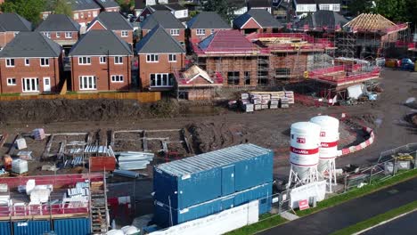 Construction-site-aerial-view-above-new-urban-real-estate-housing-development-regeneration-orbit-close-left-shot