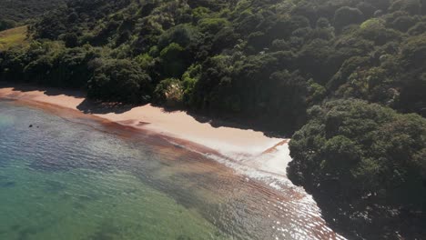 Beautiful-scenery-of-the-beach-in-Purerua-Peninsula-Rangihoua-Bay-Marsden-Cross-Northland-New-Zealand-Aerial-pull-in