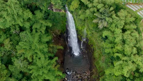Exotic-Curug-Silawe-waterfall-surrounded-by-tropical-landscape,-Java,-Indonesia