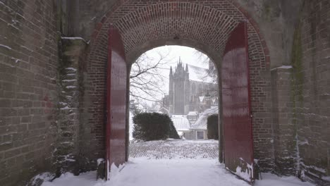 Burcht-van-Leiden-city-gate-in-winter-snow,-walking-point-of-view-POV