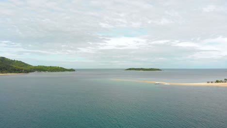 Pull-out-reveal-drone-shot-of-a-scenic-sandbar-Island