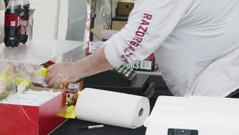 A-man-prepares-to-serve-food-during-Dogwood-Festival,-Siloam-Springs,-Arkansas