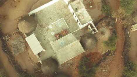 Aerial-View-Huts-And-White-Building-In-Tharparkar