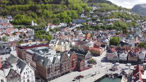 Spectacular-summer-day-aerial-of-Bergen-city-center-with-harbor,-fjord-and-view-of-Floien-and-Fjellsiden---Idyllic-summer-day-aerial-with-busy-people-and-traffic