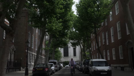 Cyclists-On-Santander-Bikes-Riding-Down-Dean-Trench-Street-In-Westminster