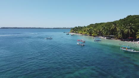 Low,-slow-aerial-approaches-idyllic-Starfish-Beach,-Caribbean-Panama