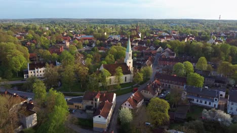 Aerial-View-of-Kuldiga-Old-Town-With-Red-Roof-Tiles-and-Evangelical-Lutheran-Church-of-Saint-Catherine-in-Kuldiga,-Latvia