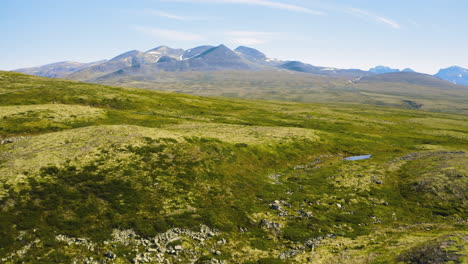 Green-rocky-hills-and-mountains-of-Rondane-National-Park-in-Norway--Wide