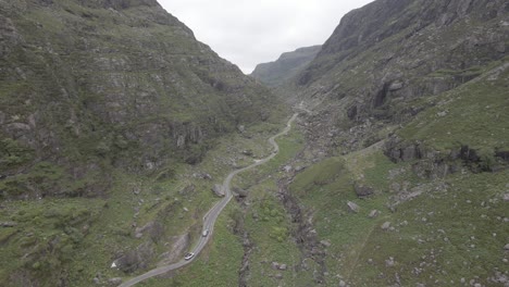 Winding-Road-Through-Towering-Mountain-Valley-At-Gap-Of-Dunloe-In-Kerry-County,-Ireland