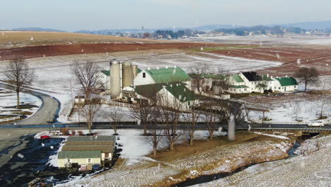 AERIAL-Snowing-Over-Rural-Farm-Property,-Pennsylvania-USA