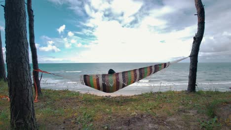 Relaxing-in-the-Hammock-by-the-Windy-Baltic-Sea-and-Enjoying-Sea-View