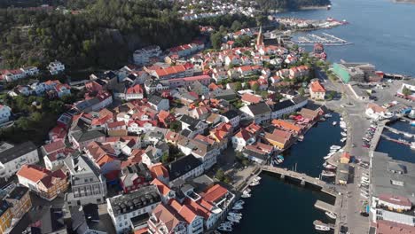 Aerial-view-of-coastal-city-with-residential-colony-at-Kragero,-Norway---top-drone-shot