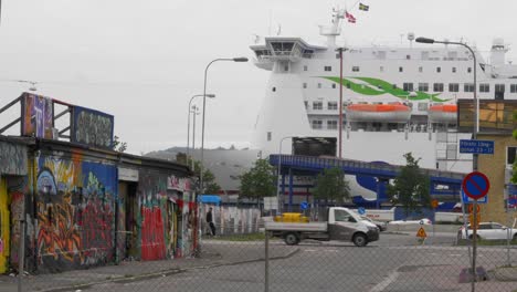 Ferry-Of-Stena-Line-Anchored-At-The-Harbour-Of-Gothenburg-In-Sweden-With-City-Road-On-Foreground