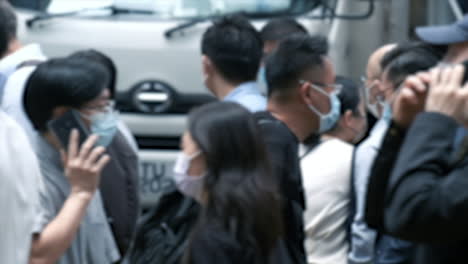 Crowd-of-people-wearing-medical-face-mask