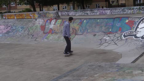 Slow-mo-of-skate-boarders-at-a-skate-park-in-Sheffield,-England