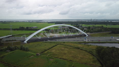 Aerial-view-of-two-sprinter-trains-crossing-the-zandhazenbrug