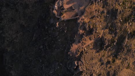 Aerial-top-down-forward-over-Monsanto-ruins-at-sunrise