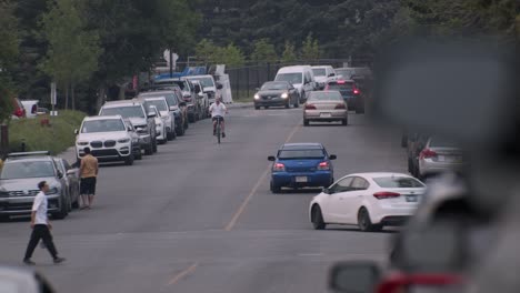 Busy-street-with-cyclist-and-pedestrian