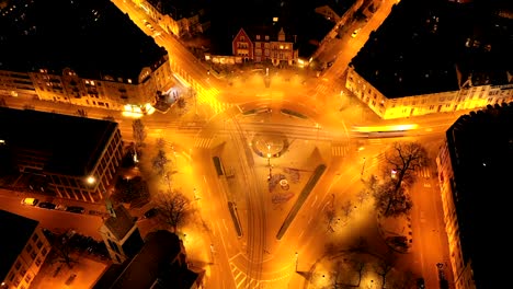Timelapse-by-aerial-of-Wettsteinplatz,-Basel-during-night-traffic