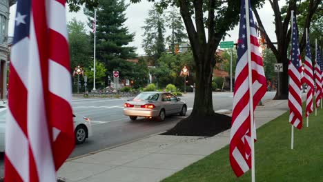 Honda-Accord-and-Toyota-Prius-stop-at-light-in-American-town-decorated-for-holidays