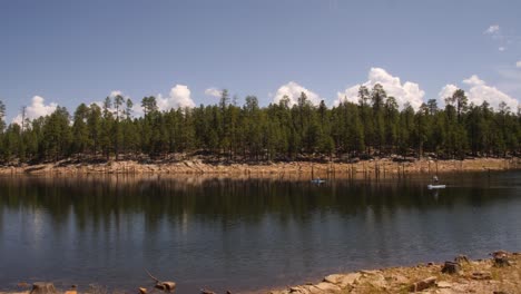 Kayak-and-paddleboards-pass-in-Willow-spring-in-Northern-Arizona-ponderosa-pine-forest