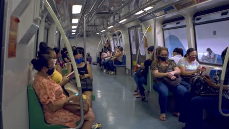 Commuters-on-the-metro-train-wear-face-masks-to-protect-against-COVID-infection
