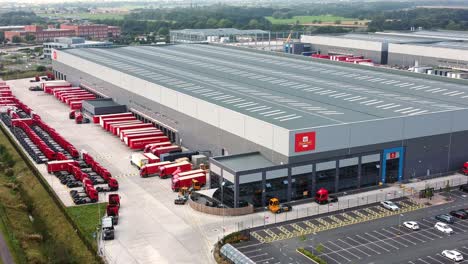 Aerial-view-international-distribution-hub-logistics-lorry-cargo-containers-parked-at-postal-sorting-depot