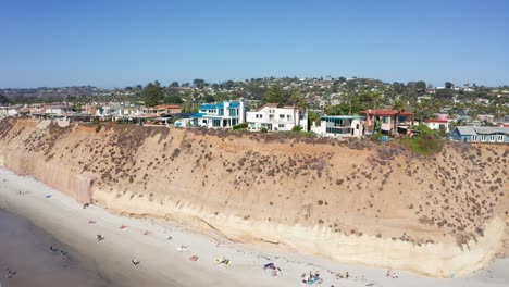 Drone-shot-orbiting-over-Solana-Beach-coastal-city-in-San-Diego,-USA