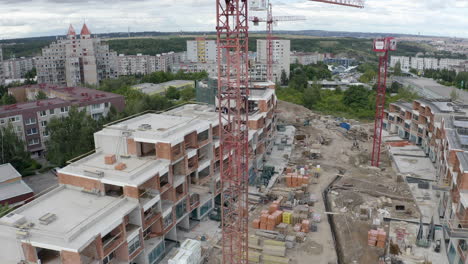 Cranes-at-construction-site-of-apartments-in-a-residential-area,drone
