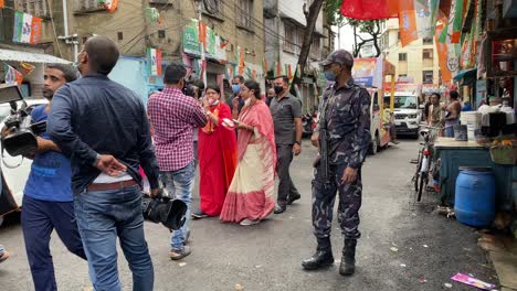 BJP-candidate-in-Bhowanipore-attending-a-road-show-with-crowded-people-in-street-of-Kolkata