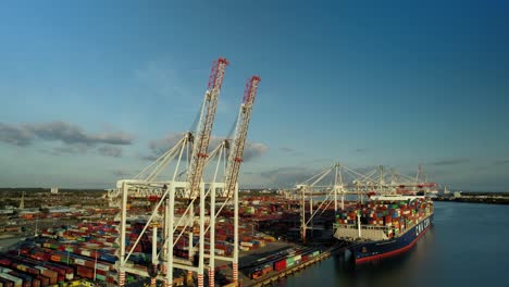 Pull-out-aerial-shot-over-DP-world-in-Southampton