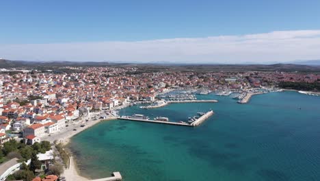 Aerial-Of-Vodice-Town-With-Amazing-Turquoise-Coastline-And-Marina-On-Adriatic-Coast,-Croatia