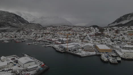 Aerial-View-On-The-Harbor-Of-The-Small-Town-Of-Skjervoy-On-A-Cloudy-Day-Of-Winter-In-Troms-County,-Norway---drone-shot