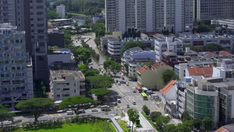 Cars-and-buses-along-downtown-Singapore-road-on-sunny-day