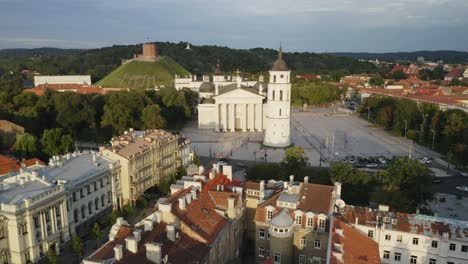 AERIAL:-Flying-Towards-Vilnius-Cathedral-and-Bell-Tower-in-Summer-with-Gediminas-Hill-in-Background